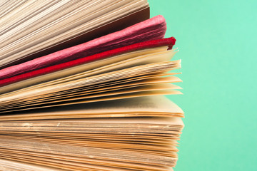 Top view of bright colorful hardback books in a circle.