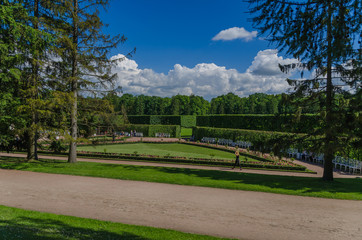 Fototapeta premium A horizontal road in a European garden. Summer vacation in the park.