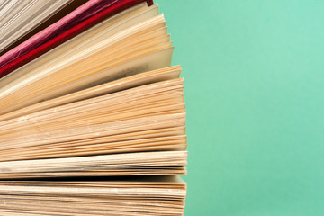 Top view of bright colorful hardback books in a circle.
