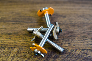 Many scattered mills. Cylindrical cutter with straight teeth. Milling cutter and router bit.