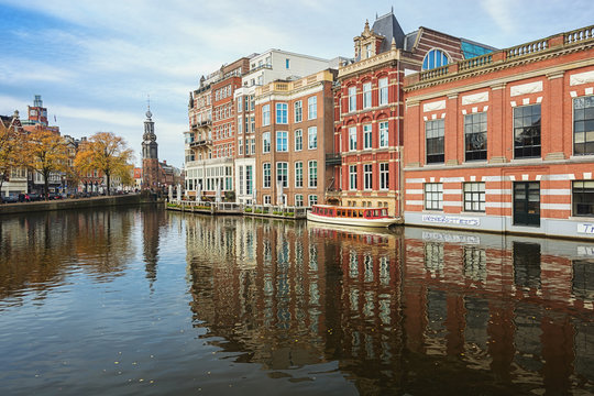 The river Amstel with the Munttower in the background