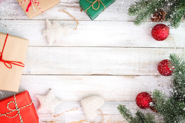 Christmas background - Christmas present gifts box and decorating elements on white  wooden background with snowflake. Creative Flat layout and top view composition with border and copy space design.