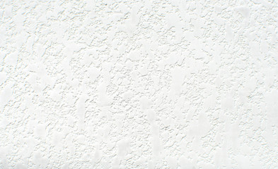 Texture of white wall with plaster pattern. Textured backdrop, design repair, bas-relief.
