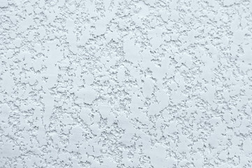 Texture of white wall with plaster pattern. Textured backdrop, design repair, bas-relief.