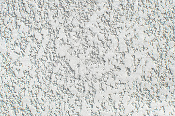 Texture of white wall with plaster pattern. Textured backdrop, design repair, bas-relief.