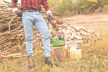 Winter is coming - lumberjack with cut woods outdoors.