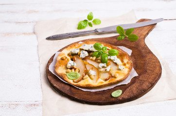 Traditional pizza with pear