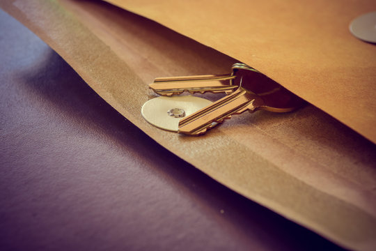 The room key in envelope, Business Delivery concept.Vintage tone