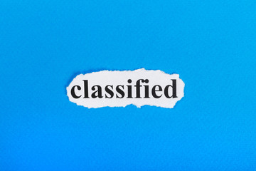 classified text on paper. Word classified on torn paper. Concept Image