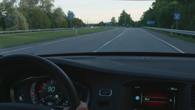 90 km/h driving car in the 90 kph limit zone interior wide shot