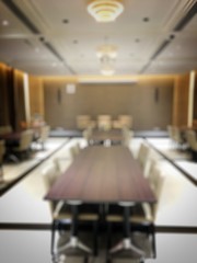 Blurred image of empty interior of conference room, meeting room prepare for webinar. Blurry nobody...
