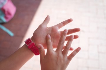 Cropped hands of student in corridor
