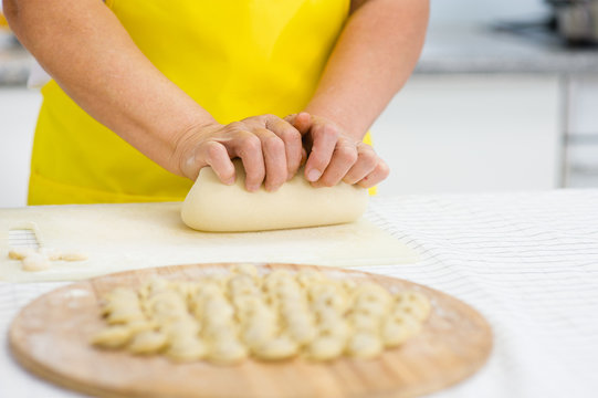 Close-up of woman's hand kneading dough