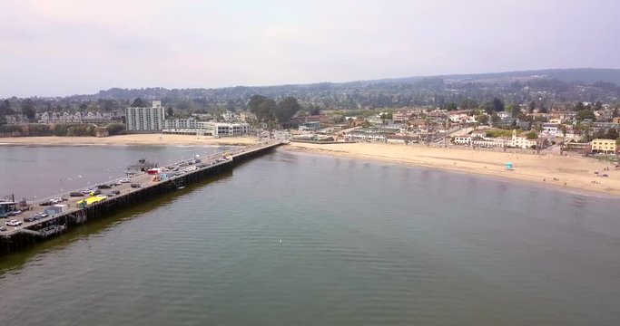 Aerial view of the Santa Cruz pier in California from above. Longest wooden pier in USA. Amazing amusement park.