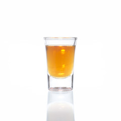 Cocktail Glass with brandy or whiskey - Small Shot. Isolated on white background