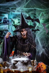 Fototapeta na wymiar Witch Is Cooking Magic Potion With Bones