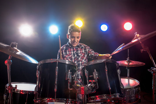 teenage boy behind drum kit