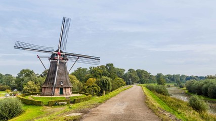 Dutch windmill on a dike