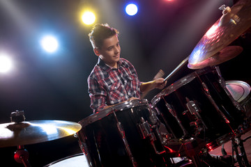 teenage boy behind drum kit