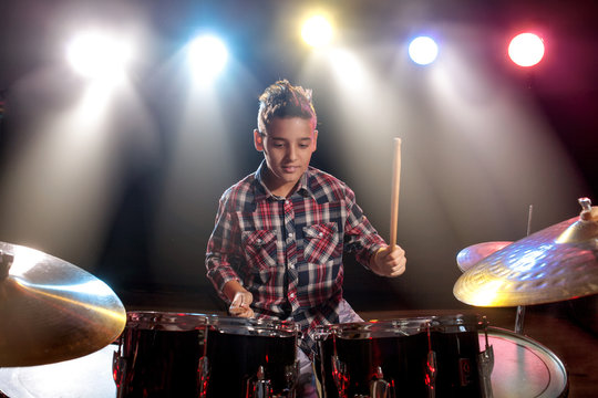 Teenage Boy Behind Drum Kit