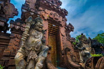 Fototapeta na wymiar Statues at the entrance of a hinduist temple in Bali, Indonesia.