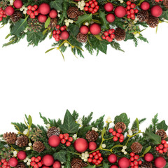 Christmas background border with red bauble decorations, holly, ivy, mistletoe, fir and pine cones...