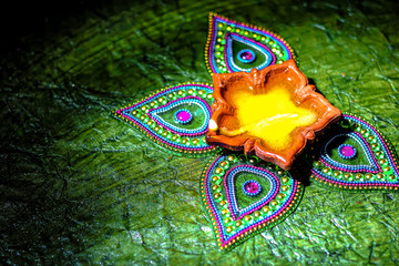 Rangoli design around Diwali lamp