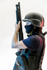 Naklejka premium Side view of man holding rifle against white background