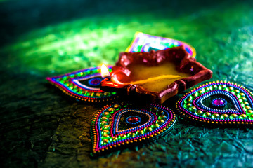 Rangoli design around Diwali lamp