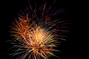Fireworks bursting color on black sky