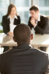 African american male job candidate waiting for hiring decision on job interview, caucasian...