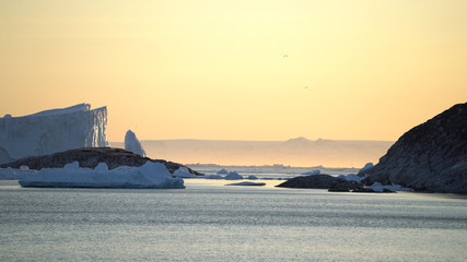  Arctic Icebergs in Greenland. You can easily see that iceberg is over the water surface, and below the water surface. Sometimes unbelievable that 90% of an iceberg is under water 