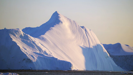  Arctic Icebergs in Greenland. You can easily see that iceberg is over the water surface, and below the water surface. Sometimes unbelievable that 90% of an iceberg is under water 