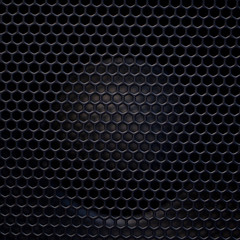 A grid with a pattern of holes with rhythmically arranged apertures