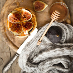 Pancakes with fresh figs, honey.Overhead view.