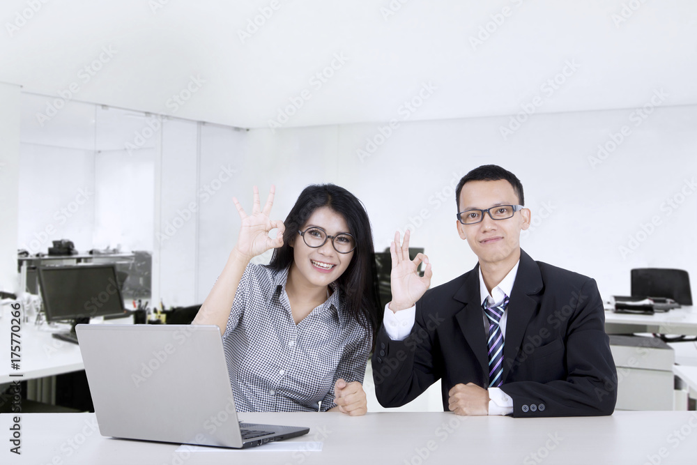 Canvas Prints Business people show OK sign at workplace