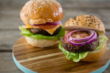 Close up of burgers on cutting board