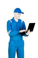 American mechanic with laptop on studio