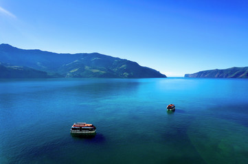 Two boats in the calm harbor at Akaroa, New Zealand