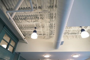 Close up on light and pipes on the ceiling interior