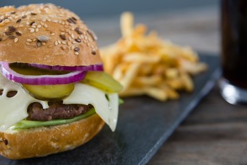 Close up of cheeseburger on slate