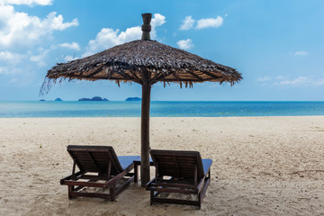 Two chaise-longue on the beach