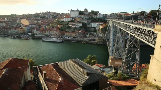 Picturesque Oporto urban landscape. Aerial view of Dom Luis I on Douro River and city skyline, Vila Nova de Gaia, Porto in Portugal. Sunny beautiful day.