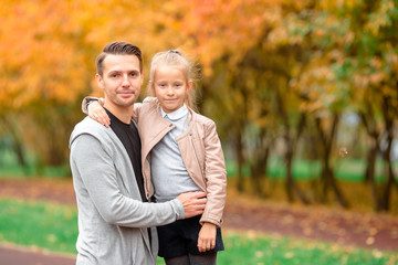 Happy family having fun on beautiful autumn day