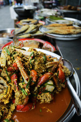 crab legs in curry paste sold in market