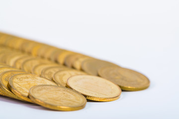 Columns of gold coins, piles of coins on white background
