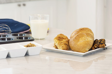 Freshly baked baguette and bread with ingredients for whole grain healthy bread.