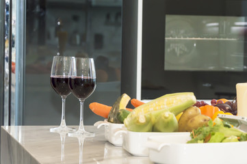 Fresh fruit, vegetable and red wine glass.