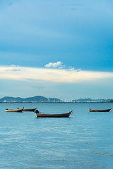Fishing boat on the sea view of Industrial Container Cargo freight shipping.