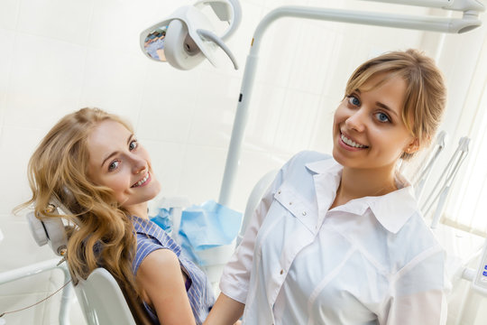 Young Professional Woman Dentist and Her Patient in the Dental Office